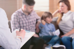 son and parents in family therapy